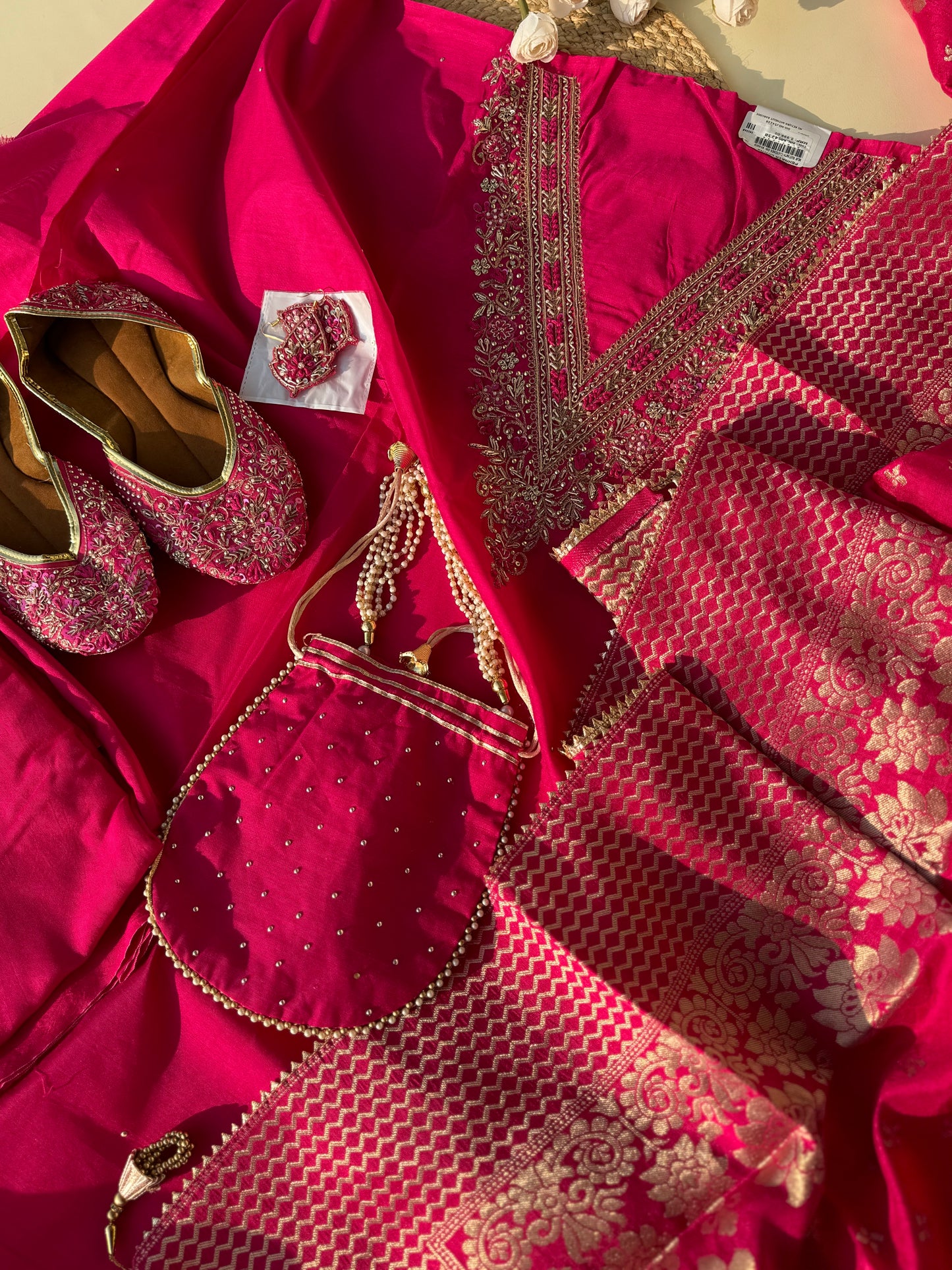 silk  unstitched suit with neck handwork detailing with complimentary potli,juttis and earings