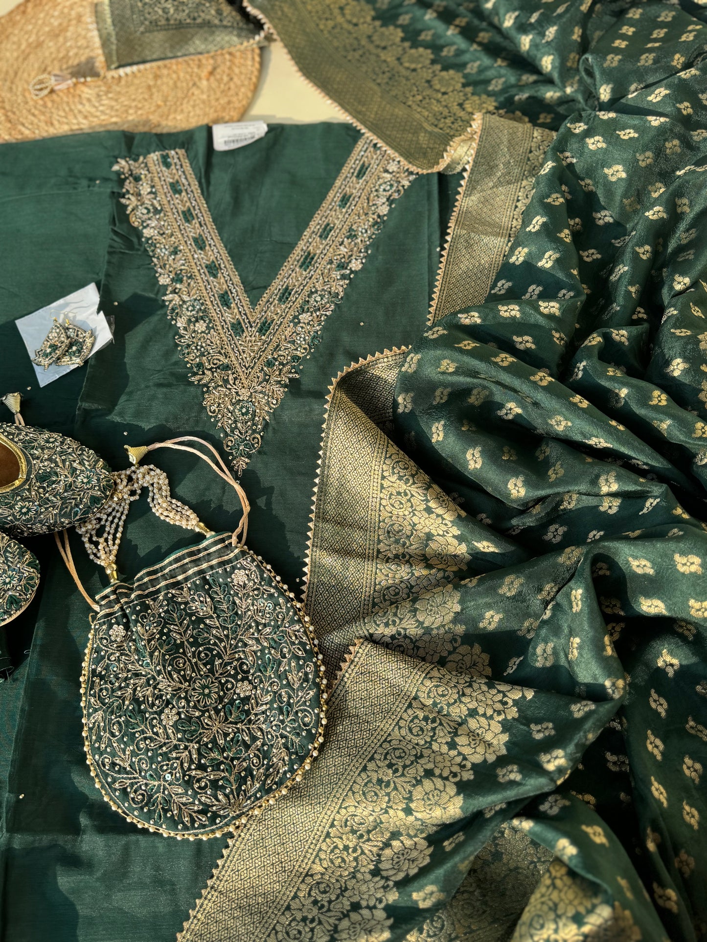 silk  unstitched suit with neck handwork detailing with complimentary potli,juttis and earings